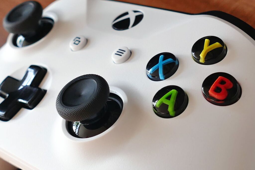 Close-up image of an Xbox controller highlighting buttons and joysticks.
